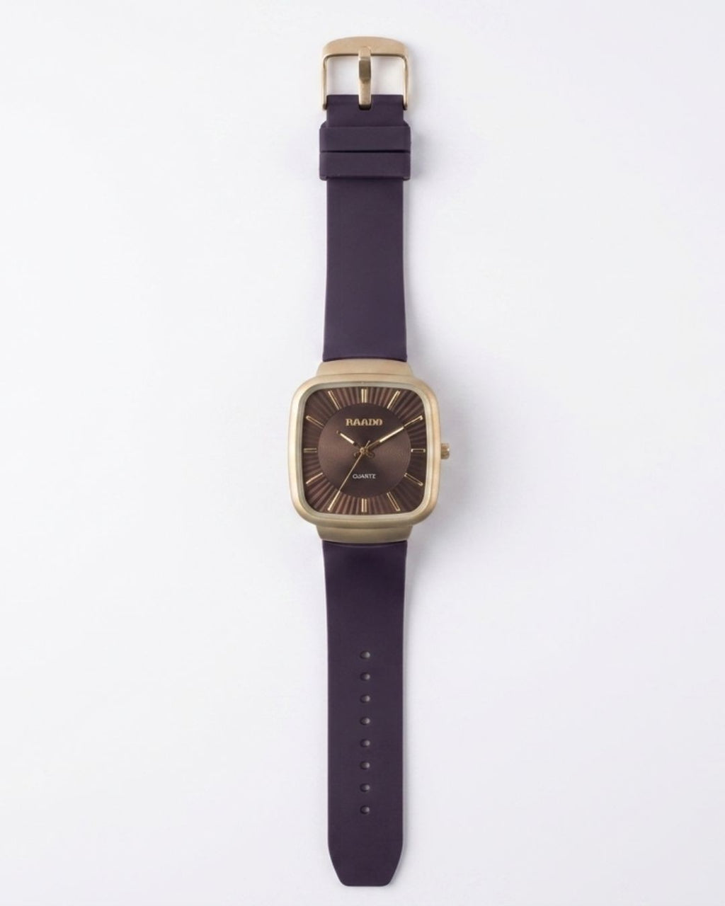 A wrist watch with a square gold-tone case, a dark brown dial, and a thick dark purple strap, shown flat against a light gray background.