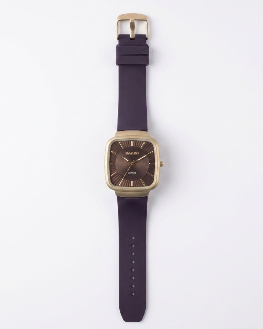 A wrist watch with a square gold-tone case, a dark brown dial, and a thick dark purple strap, shown flat against a light gray background.